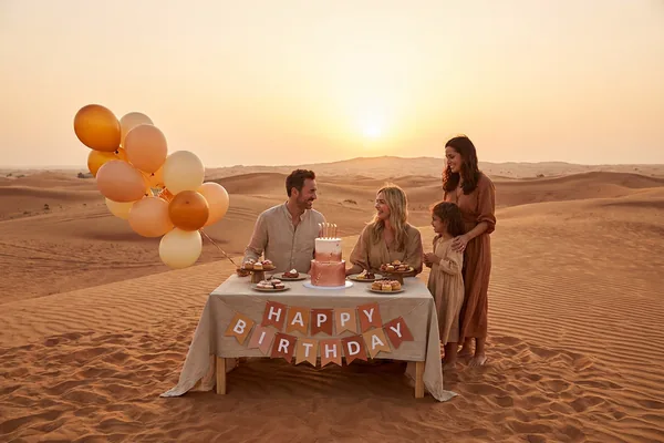 Birthday celebration detail set against the desert morning