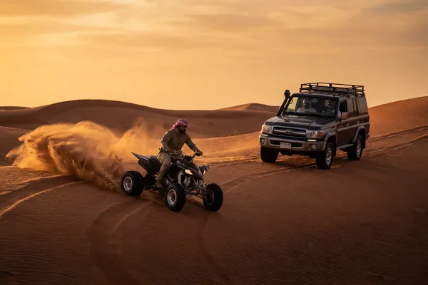 ATV riding through open Dubai sand