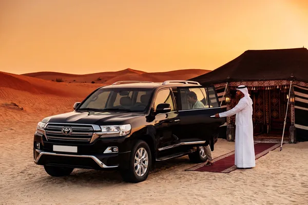 Private evening desert camp atmosphere after dune driving