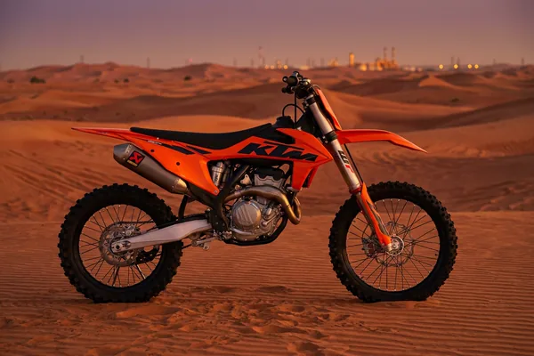 Mid-length KTM dirt bike ride through technical desert terrain