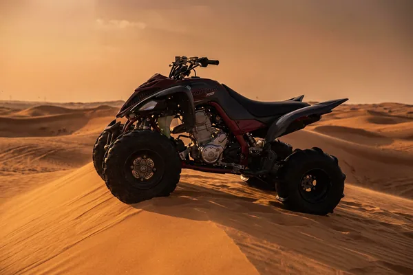 Big-bore quad bike with deeper traction through dune sand